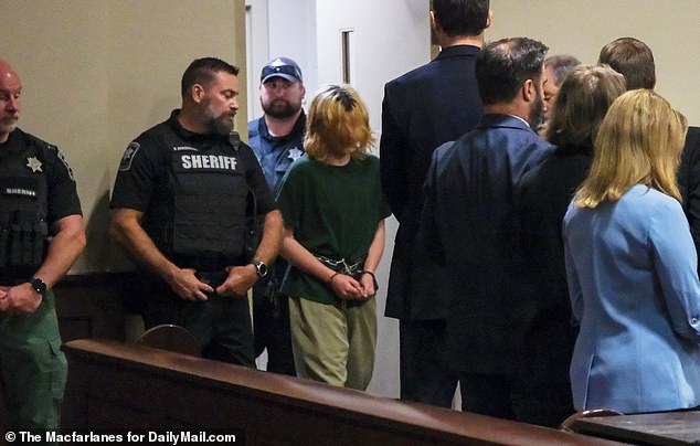 Last month, the disgraced teenager pleaded not guilty to all charges and faces life in prison if convicted. Pictured: Colt Gray, 14, appears in court on September 6.