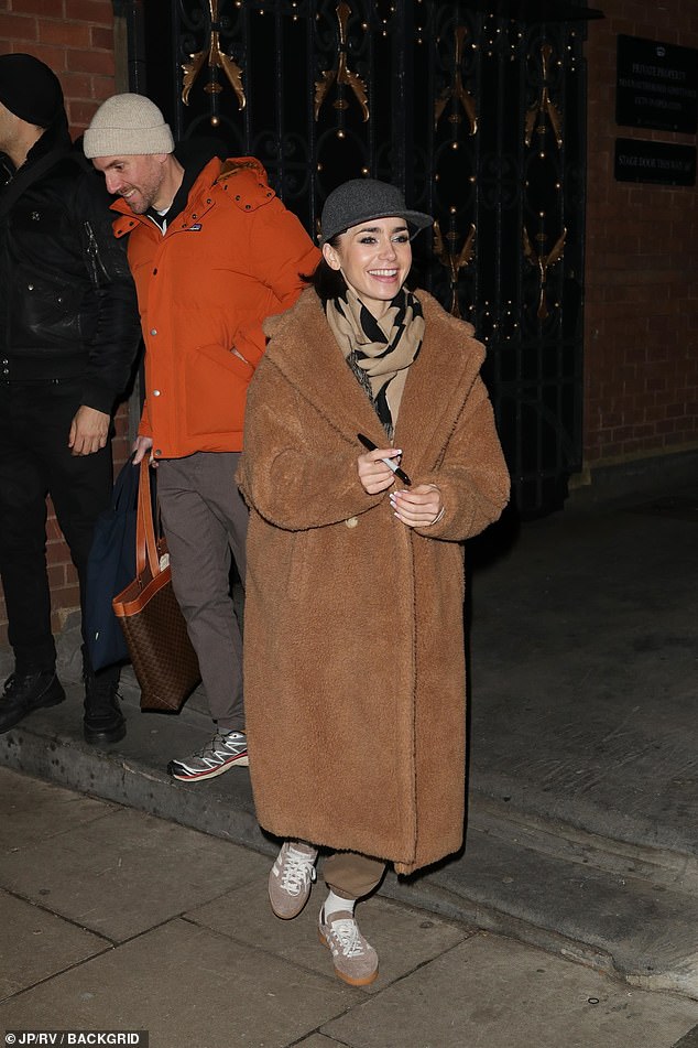 The Emily In Paris star, who made her West End debut in the show, stopped to sign autographs.