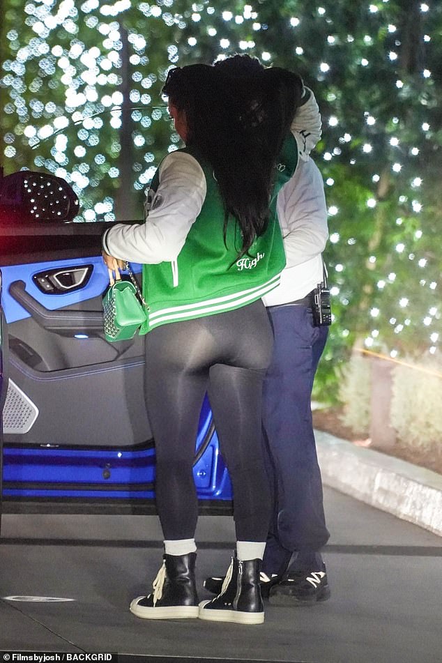 Tran showed off her curves in black leggings paired with a green university jacket and a matching handbag