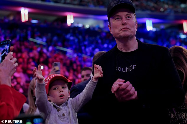 The singer revealed that she has been in a year-long custody battle with the father of her three children. Pictured: Musk and his son at a Trump rally last month.