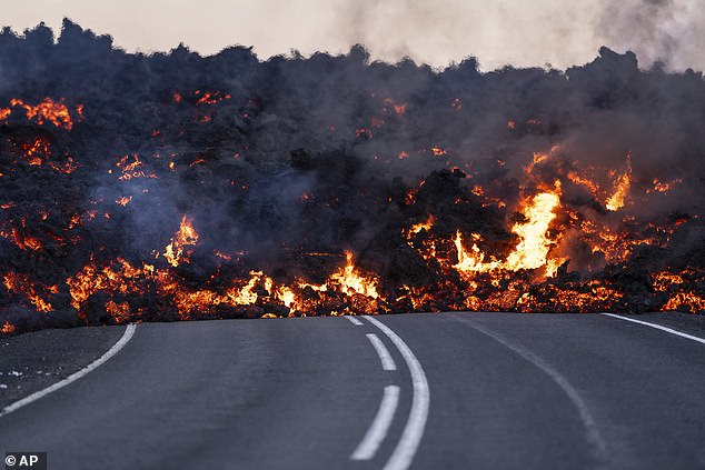 Active lava flows in front of the road heading to the Blue Lagoon near Grindavik