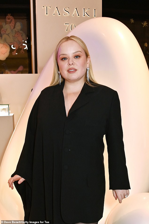 The Derry Girls star, 37, was a vision of beauty in a caped black minidress with asymmetrical sleeves and fringe details which she teamed with sheer stockings and pumps.