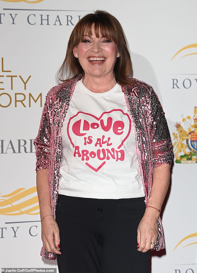 Lorraine Kelly wore a white graphic t-shirt with the words Love Is All Around for Lorraine's campaign.