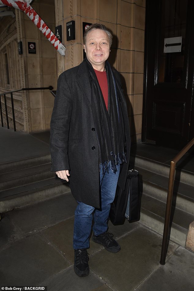 Sean Dooley seemed in good spirits as he entered the theater.