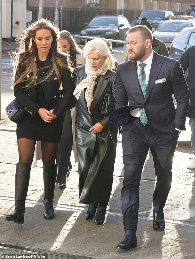 Mixed martial arts fighter Conor McGregor, his partner Dee Devlin and his mother Margaret outside the High Court in Dublin, on November 22, 2024.