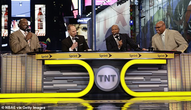 host of the "Inside the NBA" Ernie Johnson hosts the show with analysts Charles Barkley, Kenny Smith and Shaquille O'Neal at TNT's kickoff event at the Times Square offices on October 27, 2014.