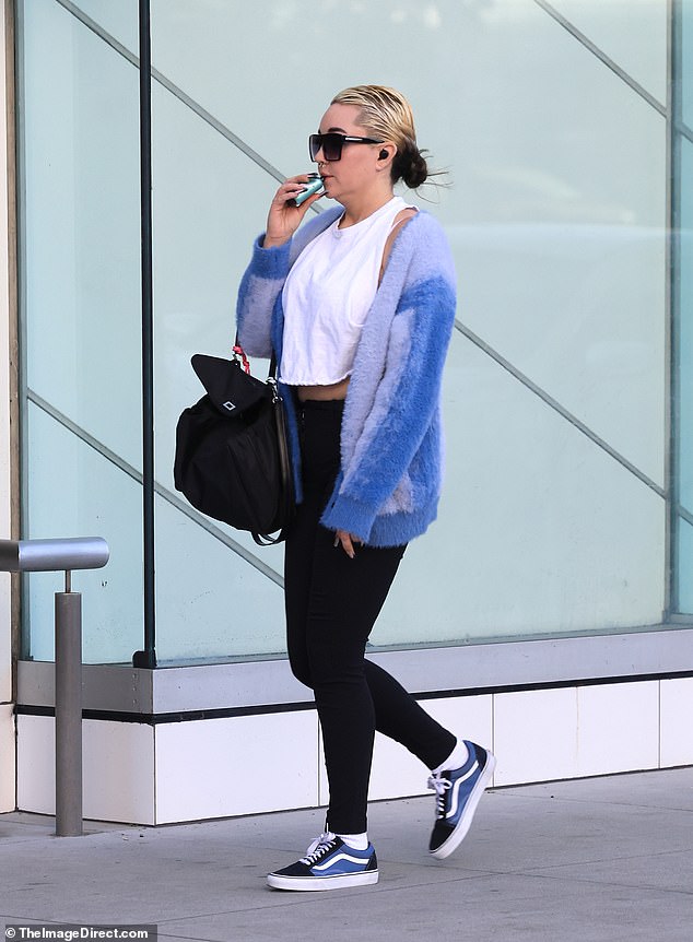 During their relaxed outing, the retired actress, 38, was seen vaping while walking down the sidewalk in a blue furry jacket, black leggings and Vans sneakers.