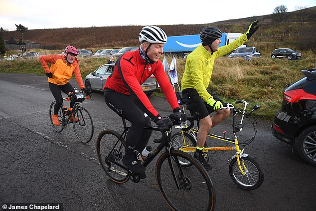 McGuinness (right) on his charity ride with Chris Hoy near Crawford in Abington, Scotland