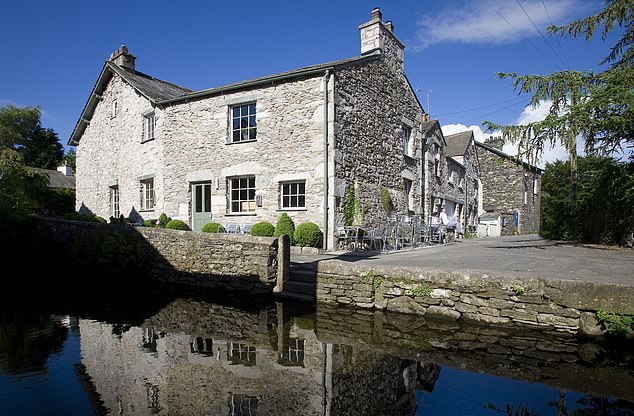 The website claimed McGuinness had taken a helicopter to three-star L'Enclume (pictured) in Cartmel, Cumbria, during his 300-mile journey.