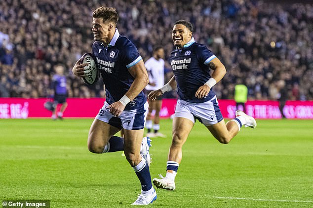 Huw Jones celebrates scoring against Fiji with Sione Tuipulotu