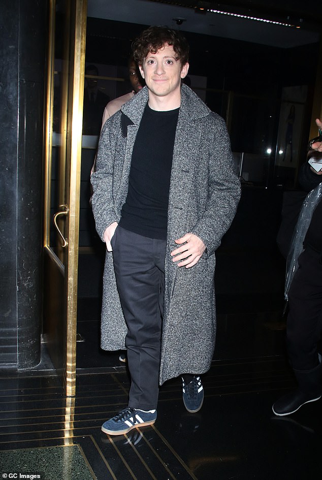 The 32-year-old cut a casual figure in a gray coat, dark T-shirt and black pants.