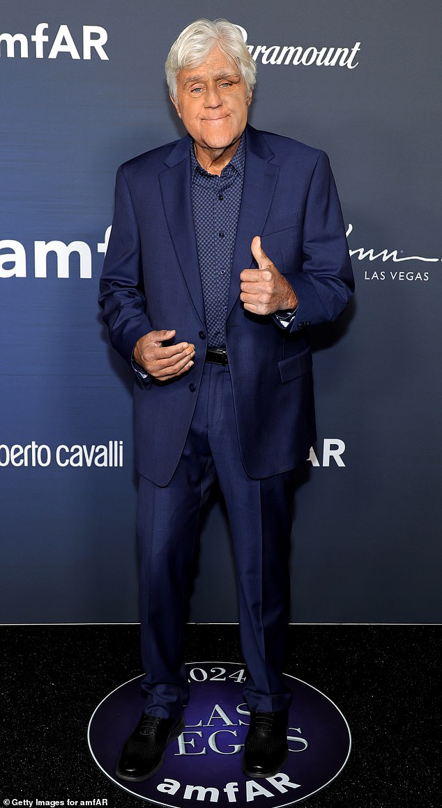 Leno seemed to be in good spirits during the adventure as he walked the red carpet in a navy suit and matching printed shirt.