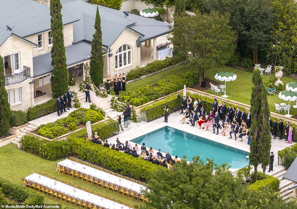 Guests surrounded the pool for Tammy and Matt's special day, while two long rows of tables were set up on the lawn next to the main event for a reception dinner.