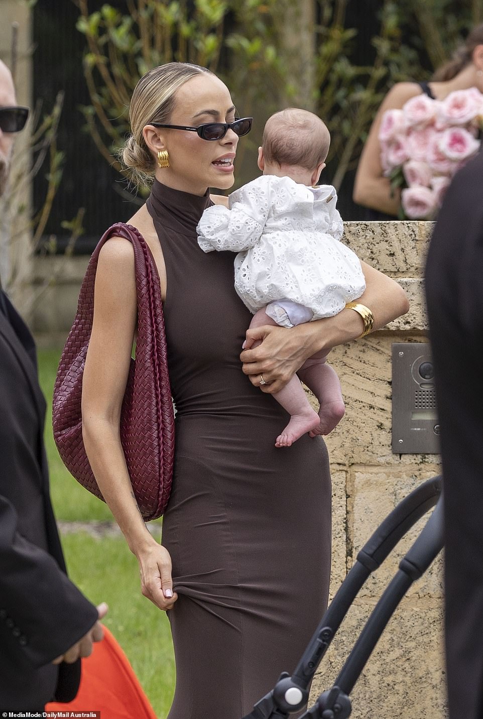 Em Davies appeared to break Tammy's childless wedding rule when she stepped out for the occasion with her fiancé Joel Gambin and their newborn daughter Isla Sue Gambin, who was born in August.