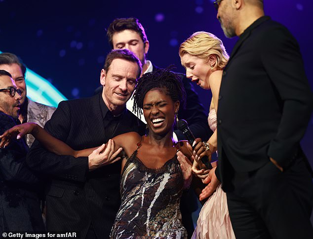 During the night, the group took to the stage with others, and a cheerful Jodie was seen supported by her co-stars as they shared a giggle together.