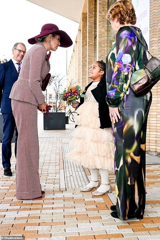 Arriving at the event on Wednesday, Máxima was seen beaming as she leaned over to shake a young woman's hand.