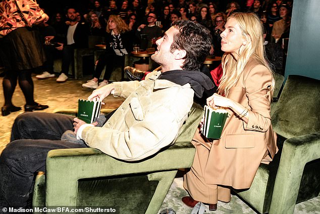 The screening also featured comfy green velvet couches and Sienna and her boyfriend Oli Green eating popcorn.