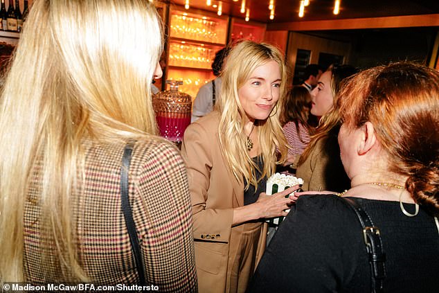 In another snap, Sienna could be seen holding some popcorn while chatting.