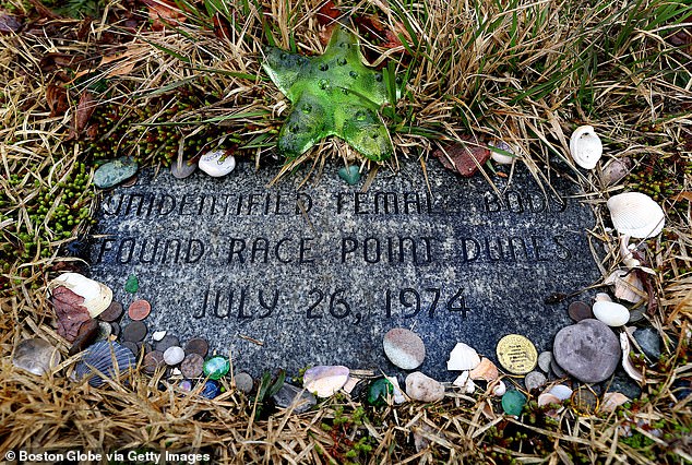 Trinkets surround the gravestone of the Lady of the Dunes, Ruth Marie Terry, in St. Peter's Cemetery, where her remains were buried