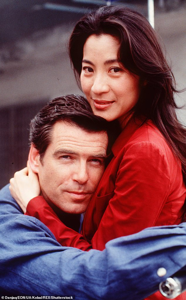 At the time of Tomorrow Never Dies' release, the Bond franchise was making a determined effort to appeal to female audiences and shed its sexist image. In the photo: Brosnan and Yeoh in a scene from the film.