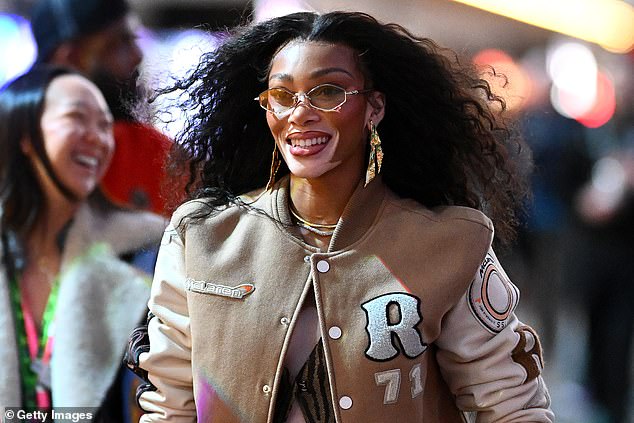 Canadian model Winnie Harlow walks through the paddock before Saturday's race.