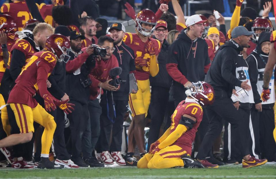 USC safety Akili Arnold celebrates after UCLA lost the ball late in the fourth quarter Saturday.