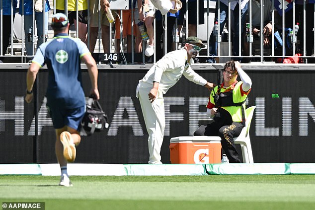 Concerns immediately arose among the players, with Nathan McSweeney and Nathan Lyon (second from left) racing towards the boundary to check on the young Stea.