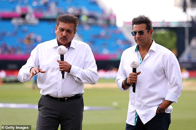 Akram (pictured with Ravi Shastri earlier this year) suffered sustained verbal abuse