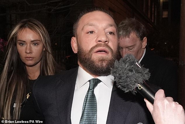 Mixed martial arts fighter Conor McGregor and his partner Dee Devlin leave the High Court