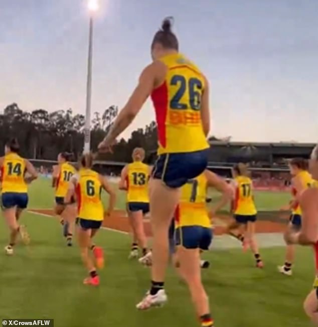 Crows players forced to run to Port Adelaide club song