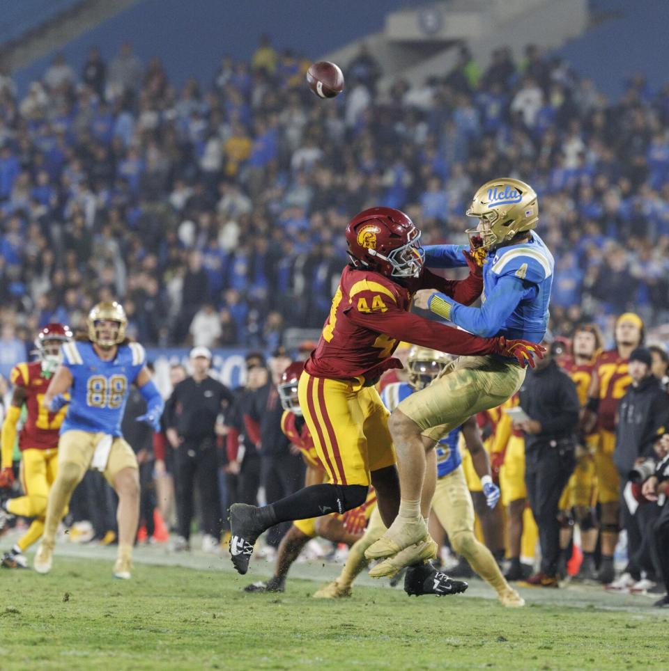 USC defensive end Sam Greene pressures and tackles UCLA quarterback Ethan Garbers on the Bruins' final offensive play.