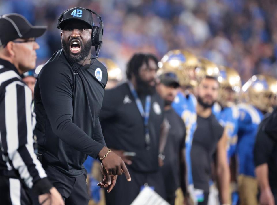 UCLA coach DeShaun Foster argues with a referee during his USC team's loss in the Rose Bowl on Saturday.