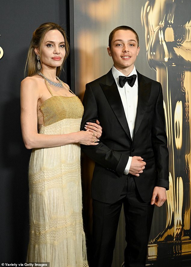 Angelina and her son Knox Jolie-Pitt walking arm in arm at the Governors Awards was 