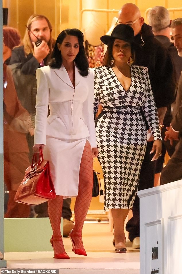 The 43-year-old reality star-turned-actress, who wowed audiences with her recent appearance on American Horror Story, was photographed in a sleek white suit that showed off her undeniable style and confidence; (pictured with Niecy Nash)