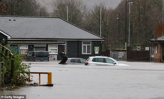 Cars in the car park at Cross Keys Rugby Club have been submerged in water as a result of Storm Bert.