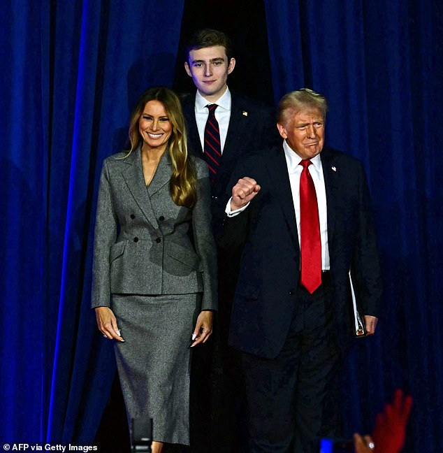 It has been reported that Barron is six-foot-nine tall and that his father goes to great lengths to avoid being photographed too close to him to avoid unflattering comparisons. Pictured: President Donald Trump arrives at an election night event with his wife Melania and son Barron.