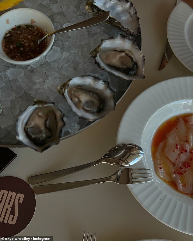 They feasted on an ice bucket of fresh oysters, steak, roast potatoes and cocktails at the exclusive restaurant.