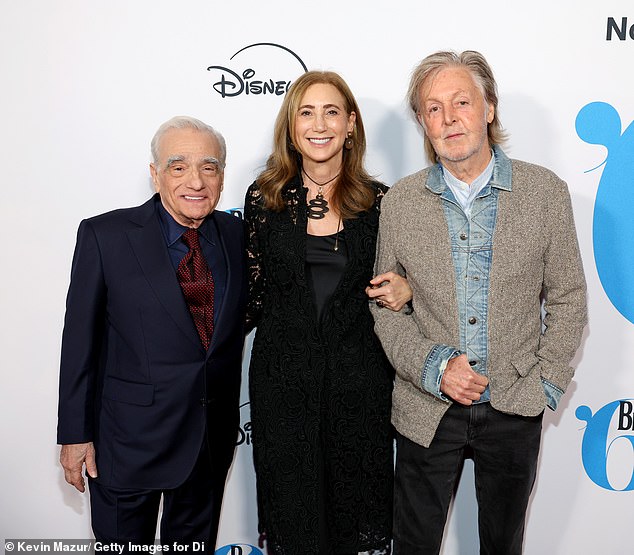 They were also joined by filmmaker Martin Scorsese, 82. He looked dapper in a navy suit, which he paired with a matching button-down shirt and a contrasting scarlet red polka dot tie.