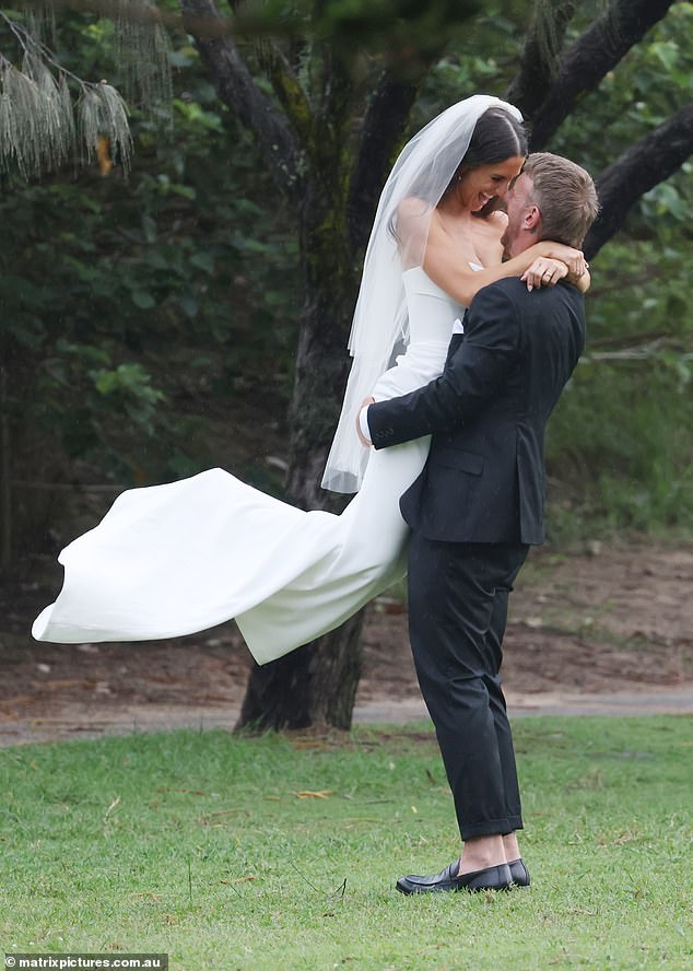 Meanwhile, the couple of the hour could barely keep their hands off each other as they posed for wedding photographs.