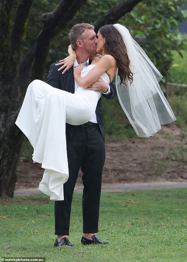 The blushing bride, who shares two-year-old son Jack with Luke, was all smiles on her big day as she shared a passionate kiss with her new husband.