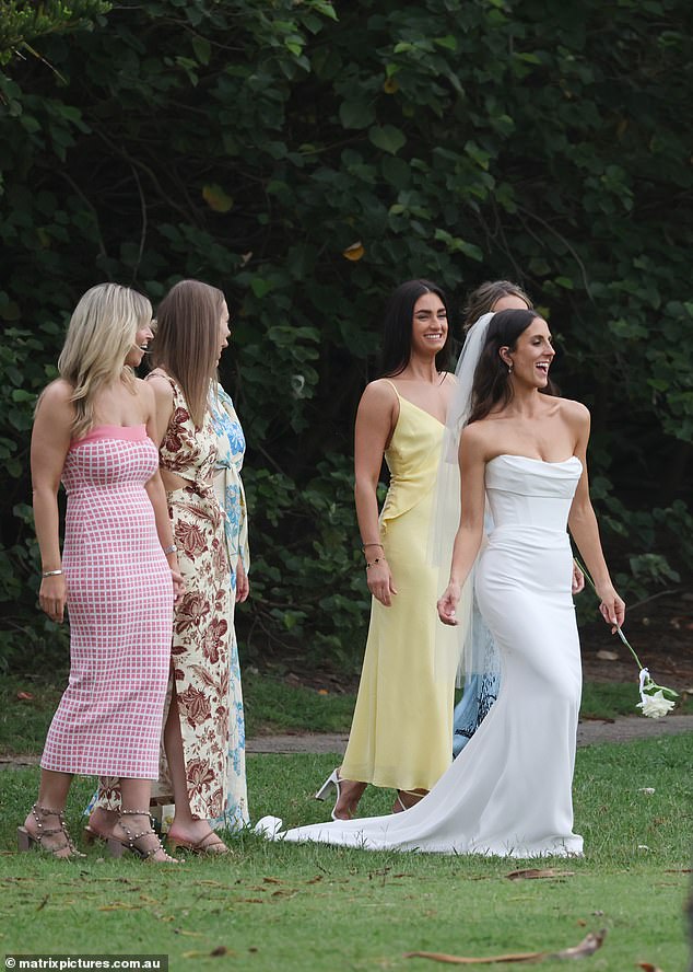 Emily struck a sultry pose while taking photos with her bridesmaids.