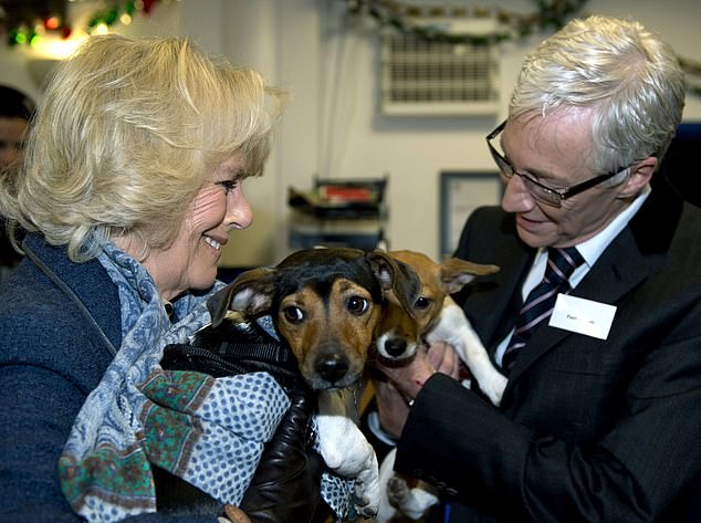 The Queen, Beth and late star and fellow dog lover Paul O'Grady with Beth and Bluebell