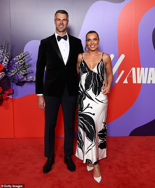 Abbey Holmes stunned as she posed with her date, footballer Keegan Brooksby, who looked dapper in a tuxedo.