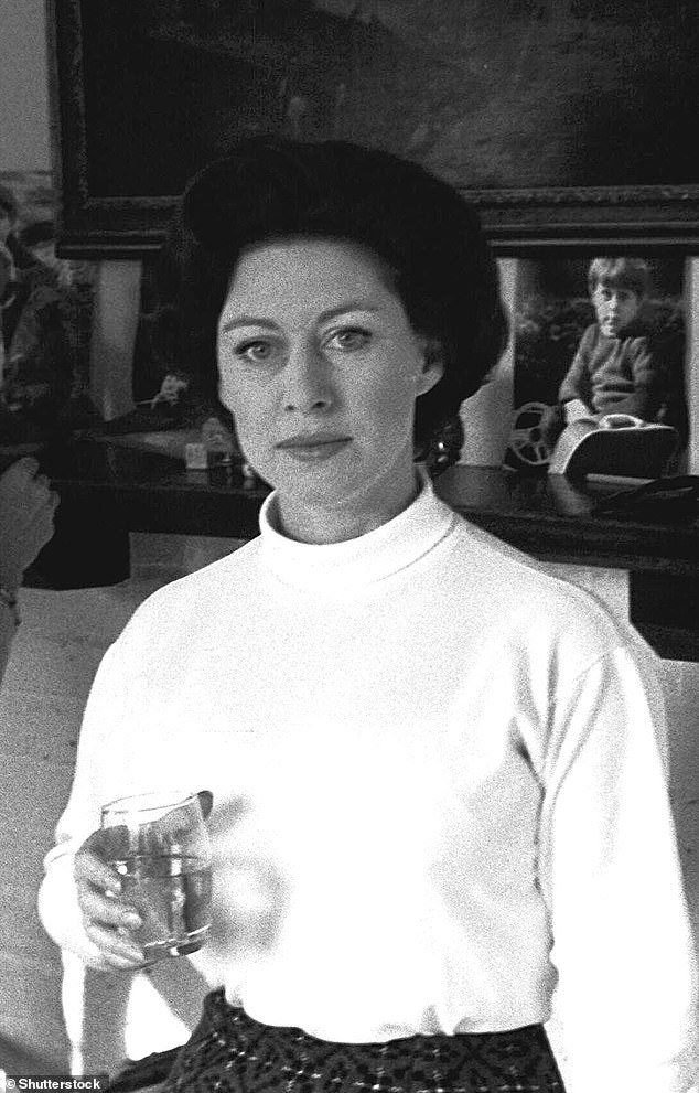 Princess Margaret having a drink in the drawing room of the Robin Douglas-Home country house in West Chiltington, West Sussex, in 1967.