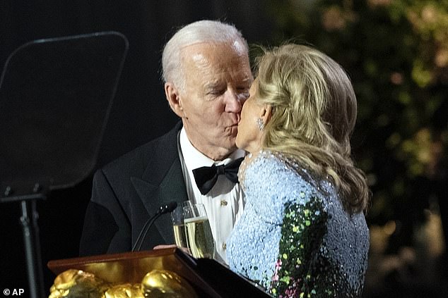 President Biden shared a kiss with the first lady as they toasted during a gratitude dinner for his loyal supporters at the White House in Washington