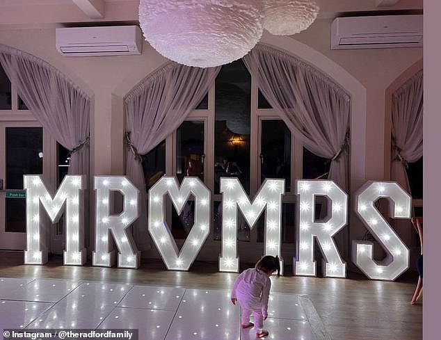 The family rented giant 'Mr & Mrs' LED lights for the wedding reception venue, along with a DJ.