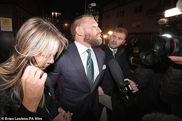 Conor McGregor and his partner Dee Devlin leave the High Court in Dublin after the verdict