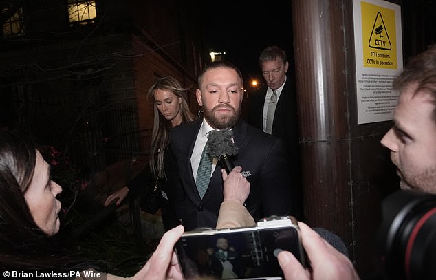 Conor McGregor and his partner Dee Devlin leave the High Court in Dublin on Friday afternoon.