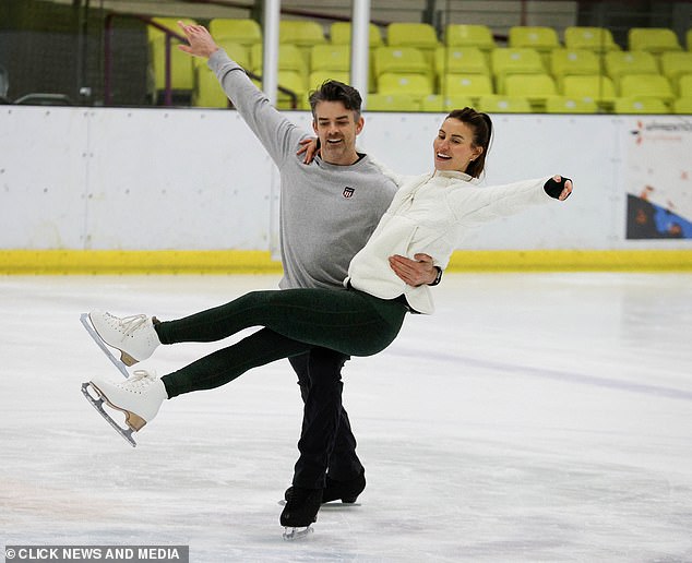 Ferne, 34, Brendyn Hatfield's partner, bundled up against the cold in a white fleece and black tights.