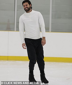 The TV personality wore a white quarter-zip and black jogging pants for another long day of rehearsals.